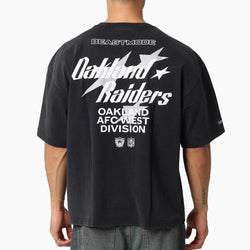 Person wearing a black t-shirt with 'Oakland Raiders' text on the back