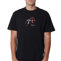 Person wearing a black t-shirt with a graphic design on a white background