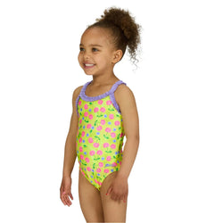 Child wearing a colorful floral swimsuit on a white background