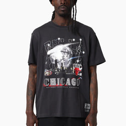 Person wearing a black t-shirt with 'Chicago' graphic design on a white background