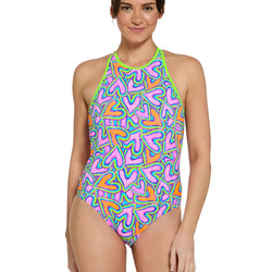 Woman wearing a colorful patterned swimsuit on a white background