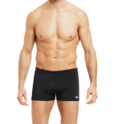 Man wearing black swim shorts on a white background